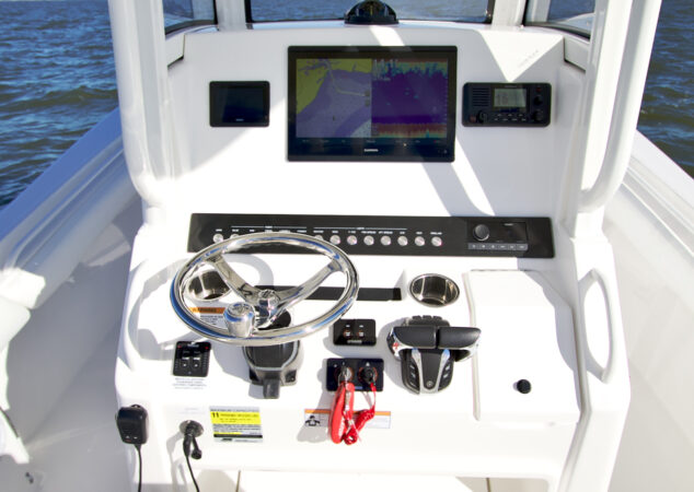 Helm station with Garmin multifunction display, Yamaha controls, and switch panel