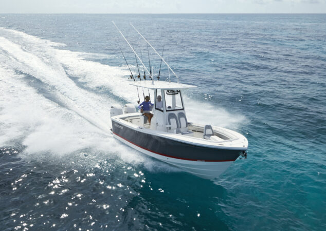 Regulator 23 fishing boat cruising across deep blue ocean water leaving a wide wake
