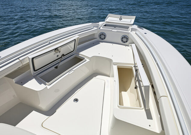 Forward deck fishbox open with additional storage and seating space
