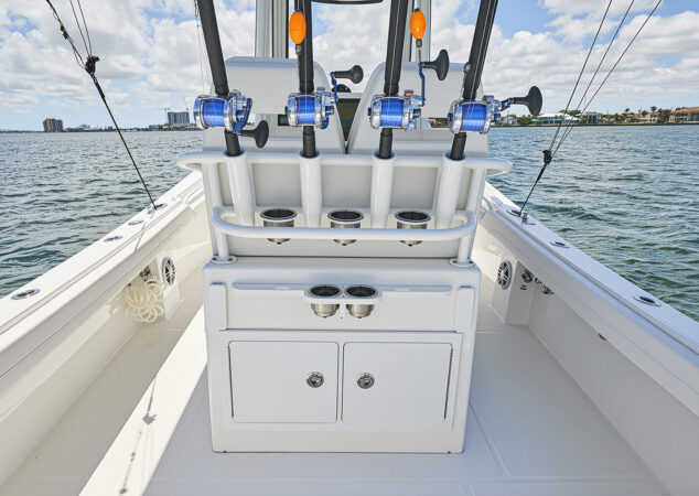 Aft-facing tackle center with rod holders, cup holders, and storage compartments