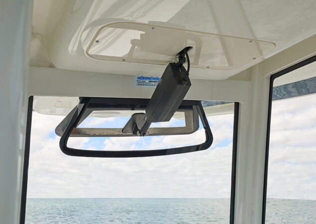 Windshield vent actuator and opening window at the helm with ocean view ahead