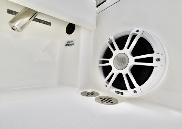 Fusion speaker with stainless drains and 120V charger outlet in cockpit