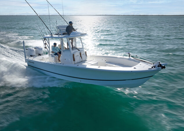 Side profile of the Regulator 30XO running offshore with twin Yamaha outboards and anglers on board