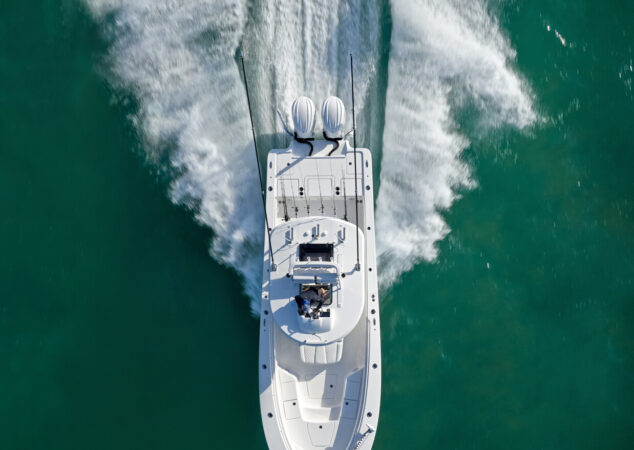 Top-down shot from behind the Regulator 30XO with twin Yamaha 300 outboards in motion