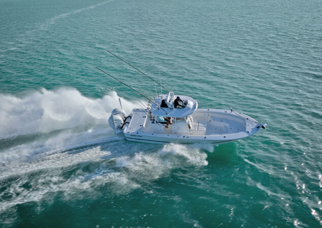 Dynamic aerial shot of the Regulator 30XO banking through a turn at speed