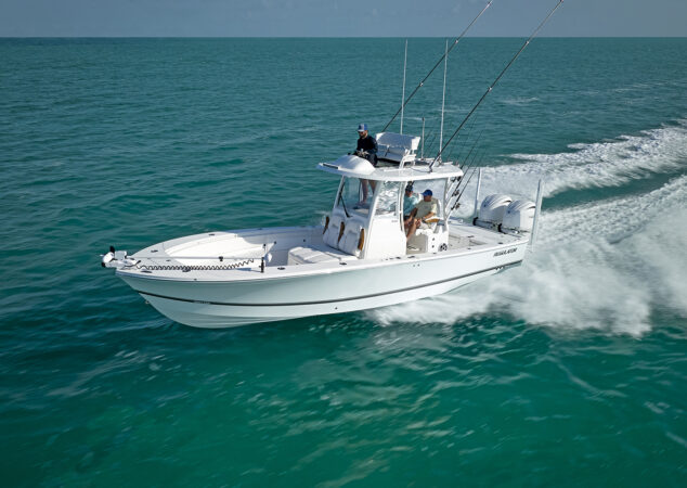 Side profile of the Regulator 30XO underway with trolling motor mounted on the bow