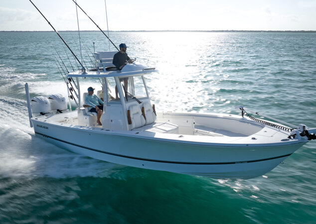 Side profile of the Regulator 30XO running at speed with twin Yamaha outboards, anglers relaxing in the cockpit