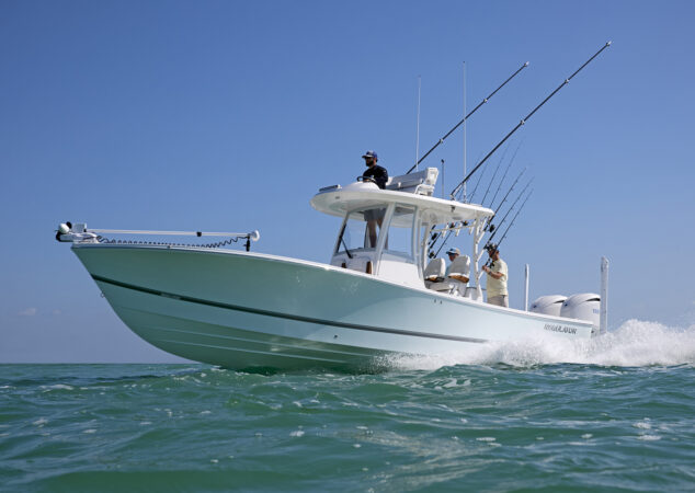 Low-angle shot of the Regulator 30XO underway, emphasizing forward flare and smooth ride