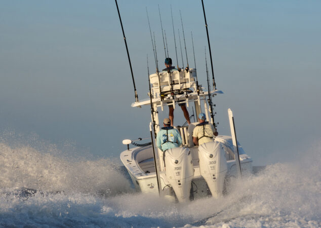 Stern view of the Regulator 30XO powering through the ocean with twin Yamaha 300 V6 outboards