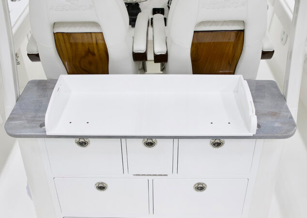 Cockpit tackle station with removable white prep tray on top of drawers