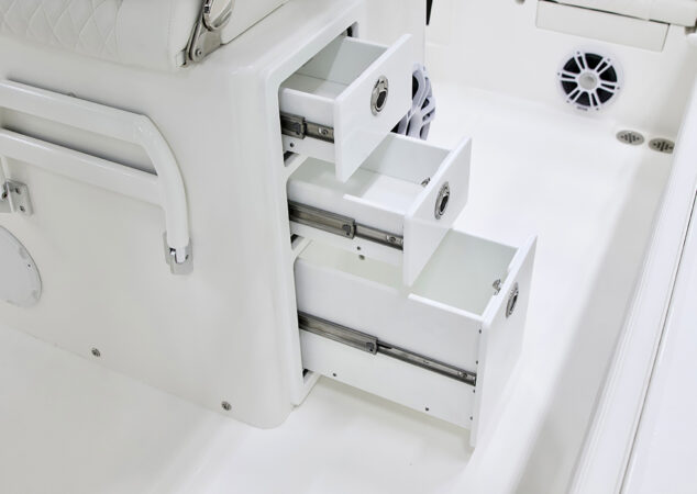 Cockpit tackle drawers partially extended, designed for tackle trays and storage