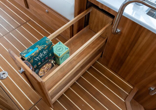Slide-out pantry drawer below the galley counter on the Sabre 43 SE