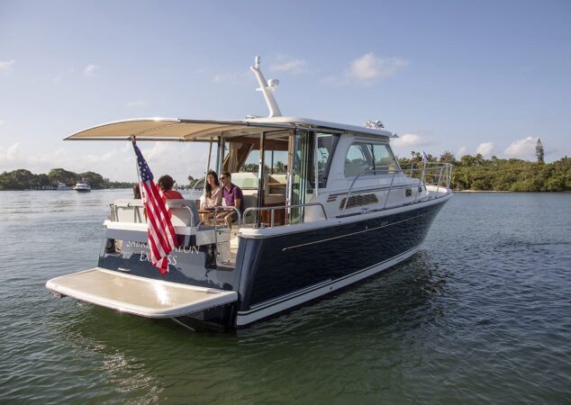 Sabre 38 Salon Express at anchor with cockpit gathering and extended swim platform