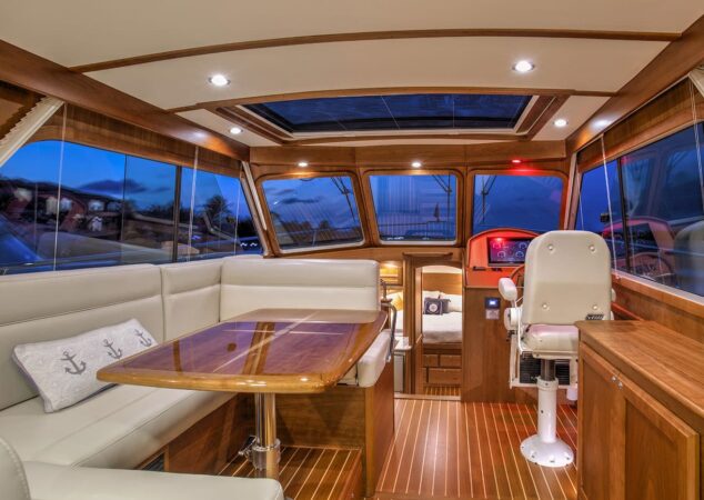 Sabre 38 Salon Express salon with U-shaped dinette, helm, and skylight