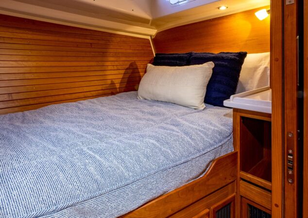 Guest cabin on Back Cove 372 with side windows and blue bedding