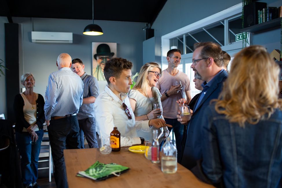 A group of individuals speaking together at a Boma event.