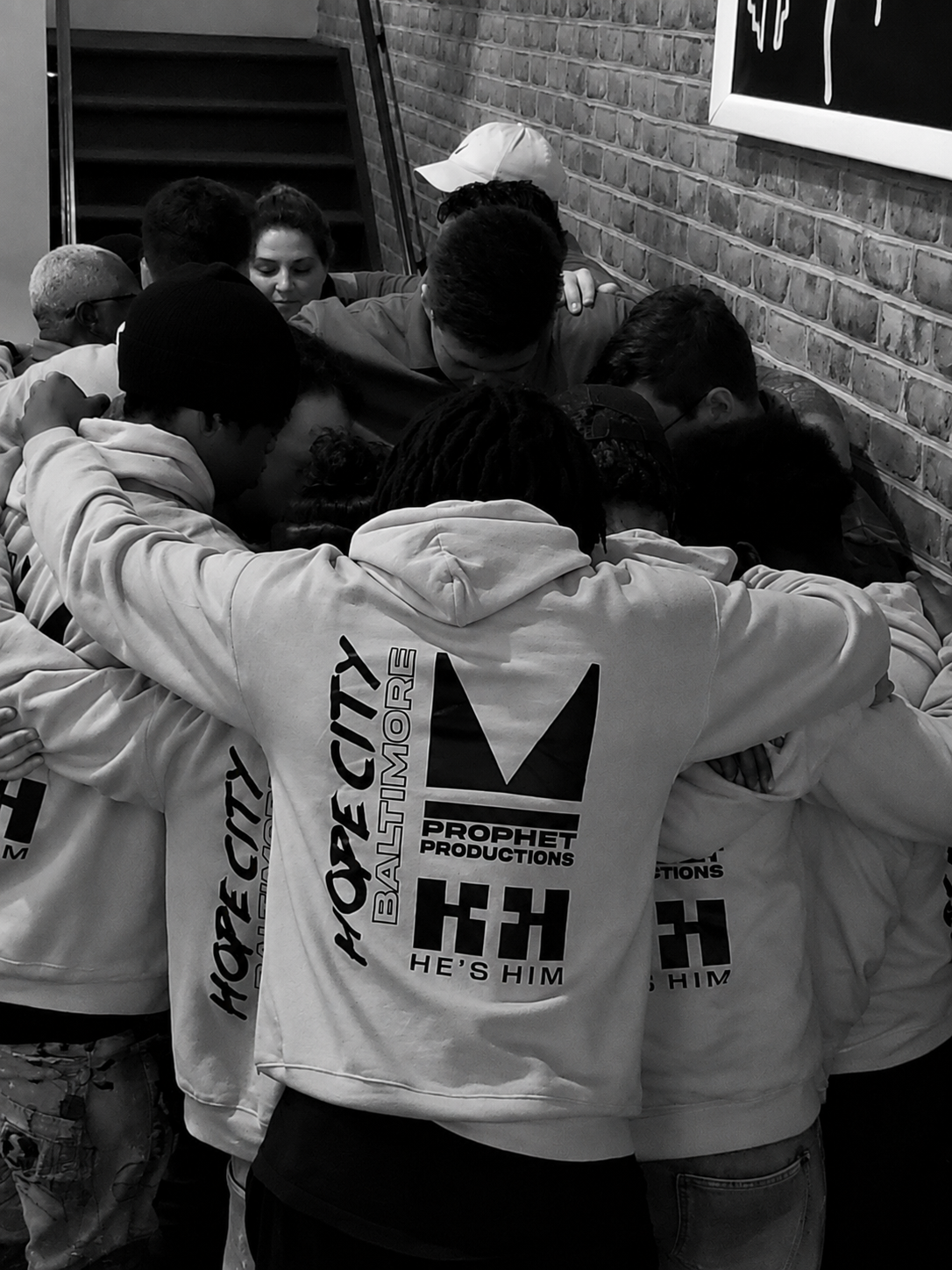 Hope City students and leaders praying together