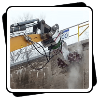 AQ-4W on Liebherr 954 with AQR4 rotation unit on Liebherr 954 Lock and Dam Concrete Removal