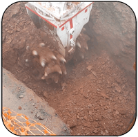 AQ4 on CAT336 Trenching in hard shale in outside of Washington DC.