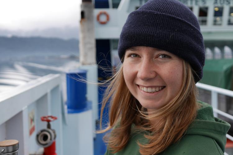 Photo of Dr. Jordan Hollarsmith on a boat deck.