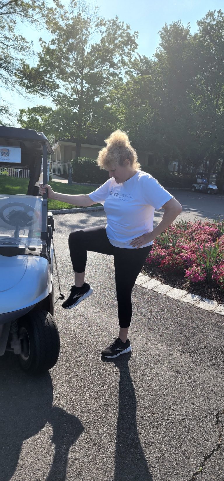 Adrienne Hogan performing one of the leg-swing exercises