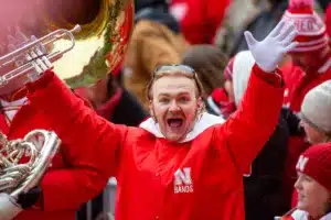 Nebraska Cornhusker marching band member mugs for the camera after the Unity Walk before  a college football game against the Purdue Boilermakers on Saturday, October 28, 2023, in Lincoln, Nebraska. Photo by John S. Peterson.