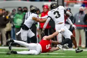 Nebraska Cornhuskers John Bullock (5) dives to tackle Purdue Boilermakers Tyrone Tracy Jr. (3) in the first quarter during a college football game on Saturday, October 28, 2023, in Lincoln, Nebraska. Photo by John S. Peterson.