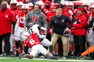 Nebraska Cornhuskers head coach Matt Rhule watches the action as it comes right at him when Quinton Newsome (6) tackles Purdue Boilermakers TJ Sheffield (8) in the first quarter during a college football game on Saturday, October 28, 2023, in Lincoln, Nebraska. Photo by John S. Peterson.