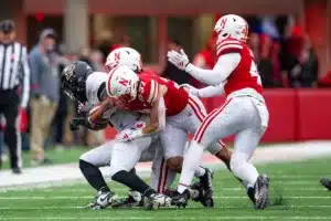 Nebraska Cornhuskers Isaac Gifford (2), Phalen Sanford (37), and Mikai Gbayor (42) tackle Purdue Boilermakers Tyrone Tracy Jr. (3) in the third quarter during a college football game on Saturday, October 28, 2023, in Lincoln, Nebraska. Photo by John S. Peterson.