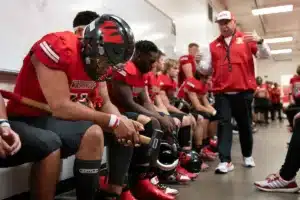 Westside High School defensive lineman Rj Eckhardt (11) and teammates listen to Westside Higih School head coach Paul Limongi before a game between Lincoln North East and Westside in Omaha, NE on Thursday October 19tth, 2023. Photo by Eric Francis