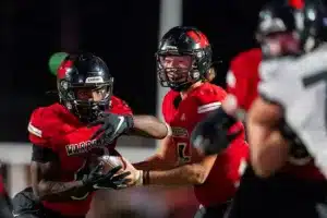 Westside High School running back Jahmez Ross (6) takes a handoff from Westside Higih School Quinton Warren (16) during a game between Lincoln North East and Westside in Omaha, NE on Thursday October 19tth, 2023. Photo by Eric Francis