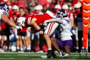 Northwestern Wildcats Devin Turner (9) tackles Nebraska Cornhuskers Heinrich Haarberg (10) in the first quarter during a college football game on Saturday, October 21, 2023, in Lincoln, Nebraska. Photo by John S. Peterson.