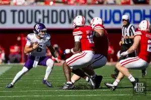 Nebraska Cornhuskers Jimari Butler (10), Nash Hutmacher (0), and Isaac Gifford (2) chase down Northwestern Wildcats Brendan Sullivan (6) in the first quarter during a college football game on Saturday, October 21, 2023, in Lincoln, Nebraska. Photo by John S. Peterson.