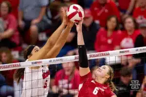 Nebraska Cornhusker Bekka Allick (5) blocks a shot from Wisconsin Badgers MJ Hammill (6) in the fourth set during a college volleyball match on Saturday, October 21, 2023, in Lincoln, Nebraska. Photo by John S. Peterson.