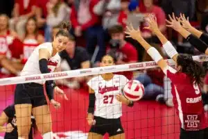 Nebraska Cornhusker Merritt Beason (13) spikes the ball against the Wisconsin Badgers in the fourth set during a college volleyball match on Saturday, October 21, 2023, in Lincoln, Nebraska. Photo by John S. Peterson.