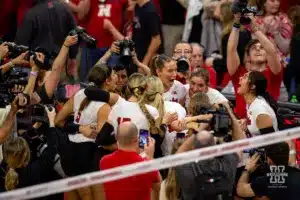 Nebraska Cornhusker celebrate a win over the Wisconsin Badgers in 5 sets during a college volleyball match on Saturday, October 21, 2023, in Lincoln, Nebraska. Photo by John S. Peterson.