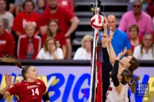 Nebraska Cornhusker Bergen Reilly (2) blocks a shot from Wisconsin Badgers Anna Smrek (14) in the fourth set during a college volleyball match on Saturday, October 21, 2023, in Lincoln, Nebraska. Photo by John S. Peterson.