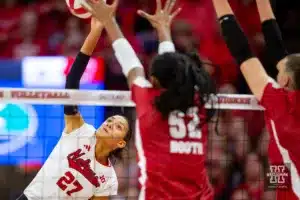 Nebraska Cornhusker Harper Murray (27) spikes the ball against Wisconsin Badgers middle blocker Carter Booth (52) in the first set during a college volleyball match on Saturday, October 21, 2023, in Lincoln, Nebraska. Photo by John S. Peterson.