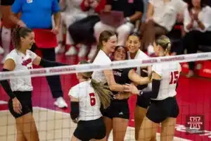 Nebraska Huskers celebrate a point in the first set against the Wisconsin Badgers during a college volleyball match on Saturday, October 21, 2023, in Lincoln, Nebraska. Photo by John S. Peterson.