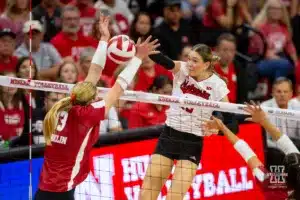 Nebraska Cornhusker Andi Jackson (15) spikes the ball against Wisconsin Badgers outside hitter Sarah Franklin (13) in the second set during a college volleyball match on Saturday, October 21, 2023, in Lincoln, Nebraska. Photo by John S. Peterson.