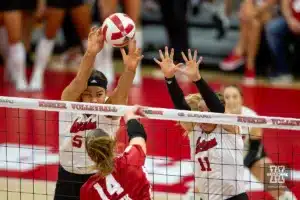 Nebraska Cornhuskers Bekka Allick (5) and Hayden Kubik (11) try to block a shot from Wisconsin Badgers Anna Smrek (14) in the second set during a college volleyball match on Saturday, October 21, 2023, in Lincoln, Nebraska. Photo by John S. Peterson.