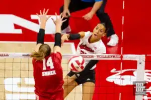 Nebraska Cornhusker Harper Murray (27) spikes the ball against Wisconsin Badgers Anna Smrek (14) in the second set during a college volleyball match on Saturday, October 21, 2023, in Lincoln, Nebraska. Photo by John S. Peterson.