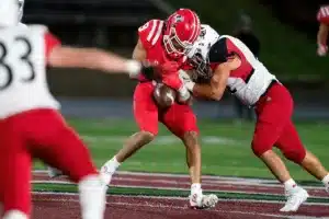 Westside High School Beau Ryan (42) knocks the ball loose from Millard South’s Amarion Jackson during a game between the Millard South and Omaha Westside in Omaha, NE on Sunday October 13th, 2023. Photo by Eric Francis