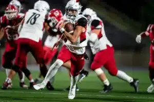 Westside High School quarterback Anthony Rezac (5) runs for a late touchdown during a game between the Millard South and Omaha Westside in Omaha, NE on Sunday October 13th, 2023. Photo by Eric Francis