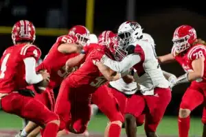 Westside High School defensive lineman Jonquel Osler (9) yes the Millard South quarterback Jett Thomalla during a game between the Millard South and Omaha Westside in Omaha, NE on Sunday October 13th, 2023. Photo by Eric Francis