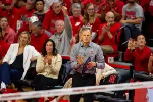 Nebraska Cornhusker head coach John Cook stands and claps celebrating a killa against the Penn State Nittany Lions in the third set during a college volleyball match on Saturday, October 14, 2023, in Lincoln, Nebraska. Photo by John S. Peterson.