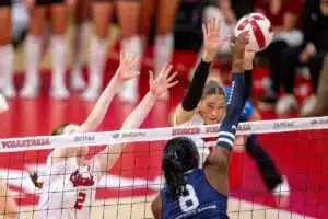 Nebraska Cornhuskers Andi Jackson (15) and Bergen Reilly (2) jump to block a shot from Penn State Nittany Lions Camryn Hannah (8) in the third set during a college volleyball match on Saturday, October 14, 2023, in Lincoln, Nebraska. Photo by John S. Peterson.