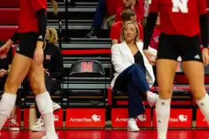Nebraska Cornhusker assistant coach Jordan Larson watching warm-ups before the taking on Penn St during a college volleyball match on Saturday, October 14, 2023, in Lincoln, Nebraska. Photo by John S. Peterson.