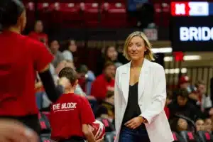 Nebraska Cornhusker assistant coach Jordan Larson watching warm-ups before the taking on Penn St during a college volleyball match on Saturday, October 14, 2023, in Lincoln, Nebraska. Photo by John S. Peterson.