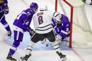Omaha Mavericks forward Ray Fust (8) tries for a goal against Niagara Purple Eagles goaltender Jarrett Fiske (31) second period during a college hockey match on Friday, October 13, 2023, in Omaha, Nebraska. Photo by John S. Peterson.